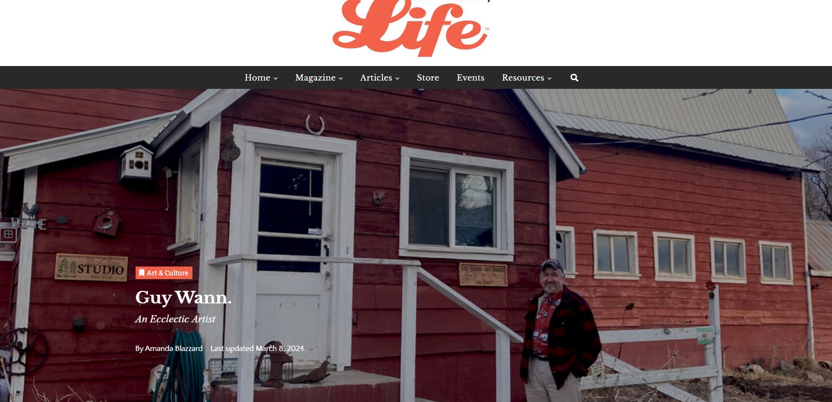Guy Wann standing in front of his Studio